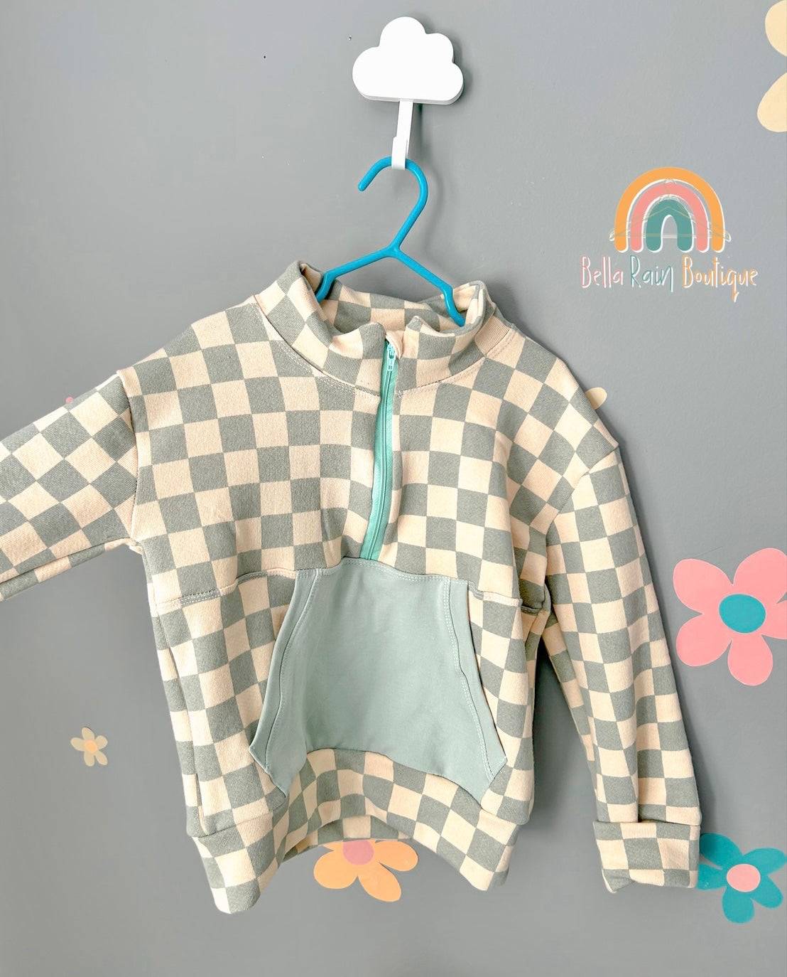 Organic Cotton Checkered Half-Zip Sweater
Our Organic Cotton Checkered Half-Zip Sweater is made from sustainable organic cotton, ensuring a durable piece that will last for seasons to come. Its checkered de