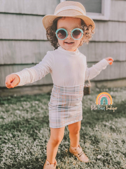 Pencil Skirt/Mock Neck TopThis plaid pencil skirt and mock neck top combo has kids looking sharp and stylish! 
* All items are sold individually 
Care Instructions: 
*Machine washed cold*Insi