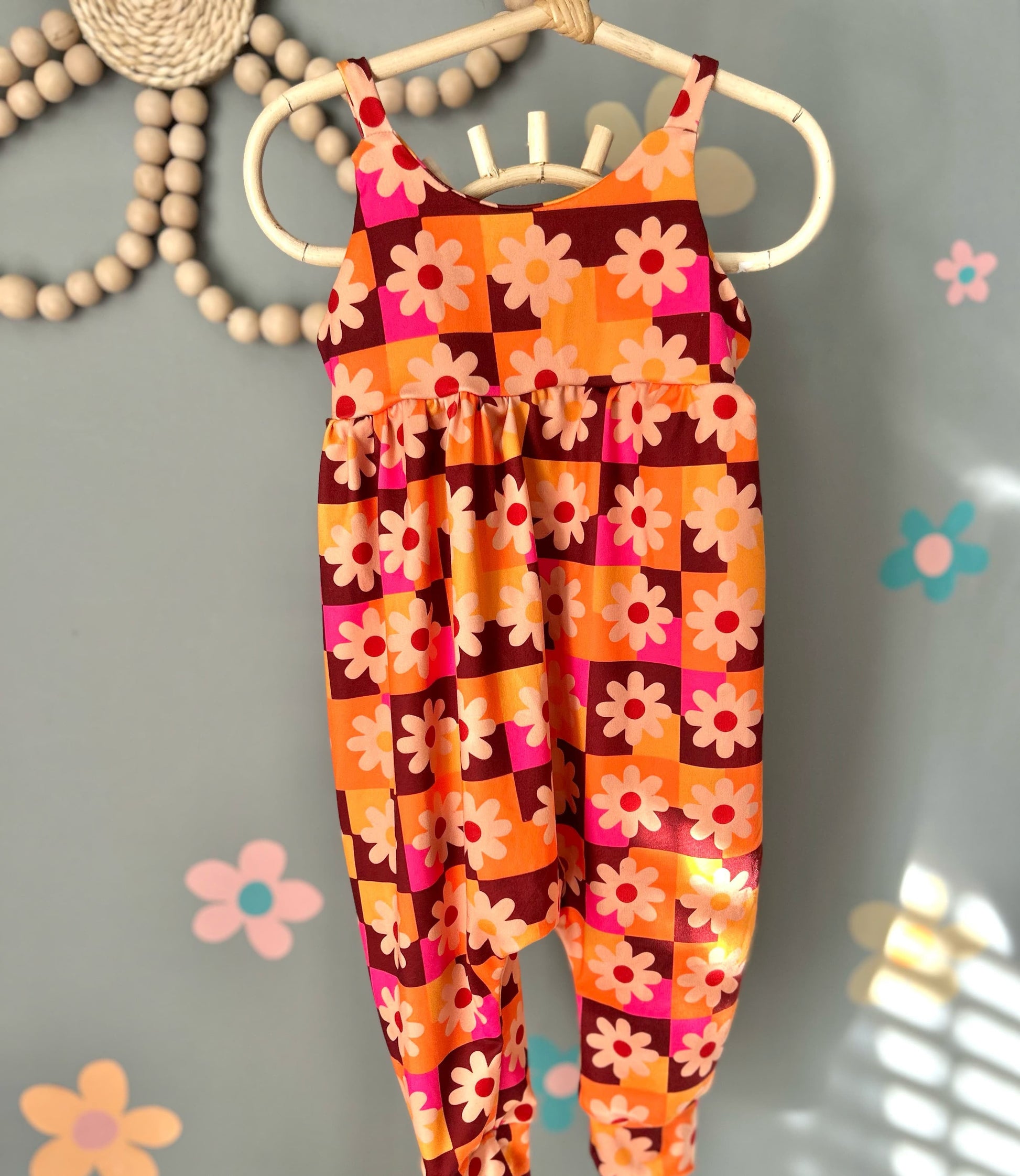 Kids bright floral strappy romper is effortless and fun!! Meet your new go to piece for mixing and matching. Layer it with a tee underneath for a casual vibe, or wear it solo for those warmer days. 