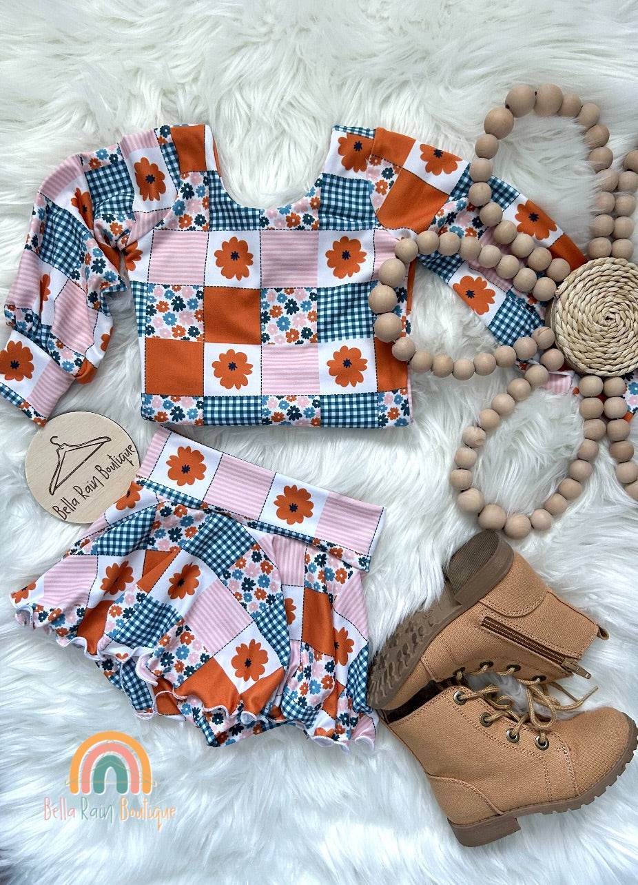Fall Patchwork Skirted Bummie SetThis Fall Patchwork Skirted Bummie Set is a must-have for autumn! The beautiful fall set is sure to brighten up any outfit with a splash of seasonal sass. Best of al